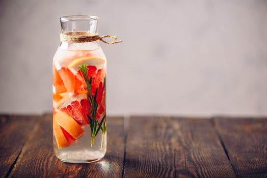 Summer Drink with Refreshing Raw Grapefruit and Fresh Rosemary. Copy Space on the Right Side.