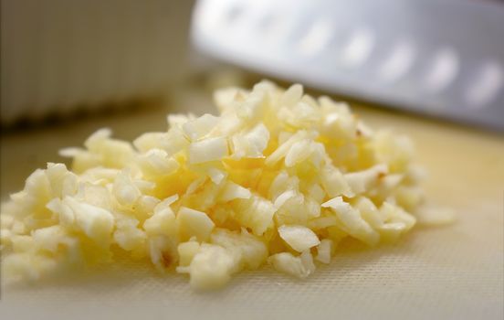 Minced Garlic on a Plastic Cutting Board