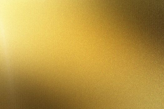 Polished golden metal plate, abstract texture background