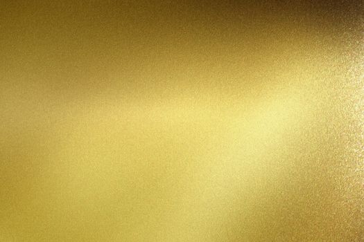 Glowing polished golden metal wall, abstract texture background