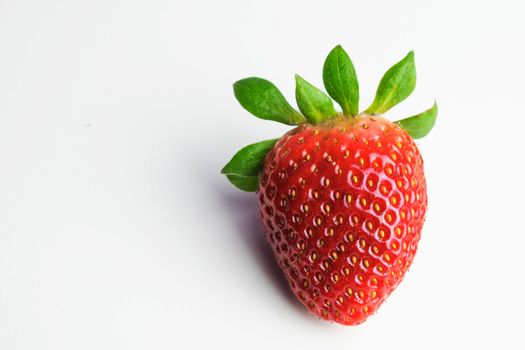 Isolated raw strawberry on a white background
