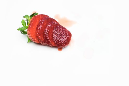 Isolated sliced strawberry on a white background