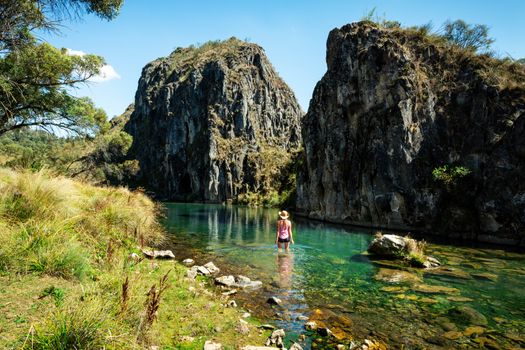 Woman wading in the spectacular Clarke Gorge of Snowy Mountains National Park.  regarded as one of the most beautiful karst areas of NSW