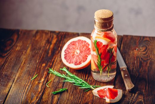 Detox Water Infused with Sliced Grapefruit and Fresh Springs of Rosemary.