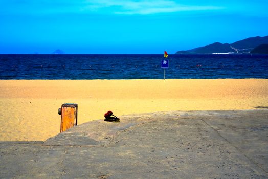 Flip flops waiting for their owner by the Nha Trang beach Vietnam.