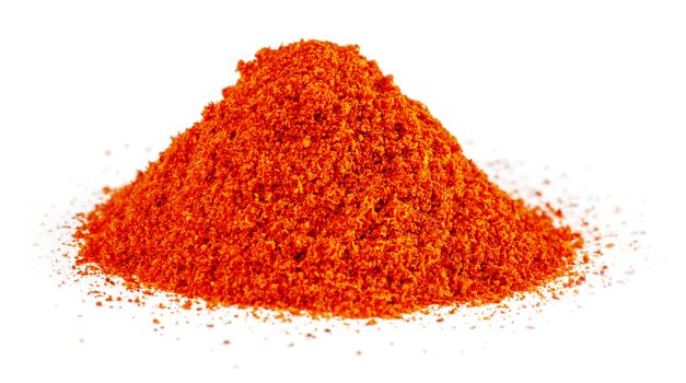 Heap of Red Chilli Pepper Powder isolated on White Background