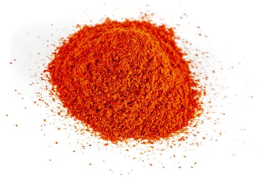 Heap of Red Chilli Pepper Powder isolated on White Background