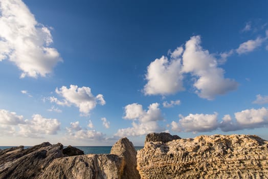 Granite rocks and ocean water in a Cancun beach, Mexico.