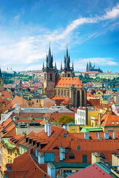 Tynsky and St Vita cathedrals among the red roofs of Prague. View from above