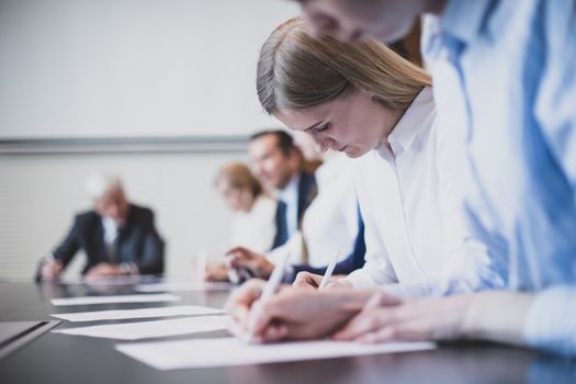 Business people working with documents in conference room