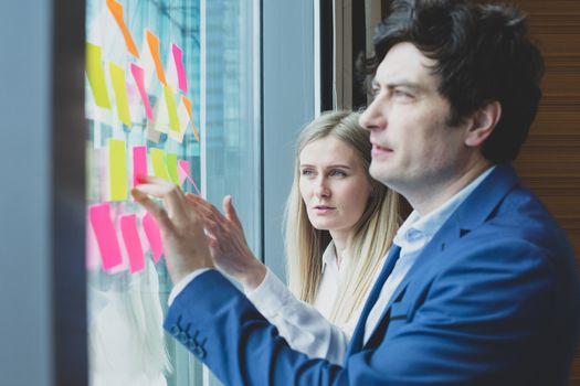 Group of business people brainstorming ideas. Entrepreneurs having a standing meeting discussing ideas strategy planning problem solution concept