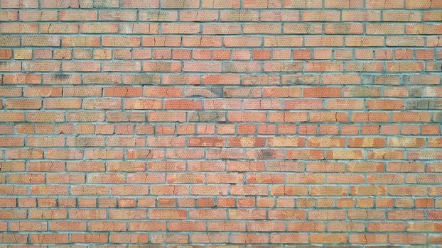 Old bricks wall, taken in the street on a cloudy day close-up. Background. Texture.