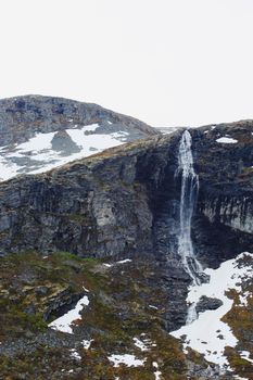 Beautiful spring Norway mountains with melting snow on tops