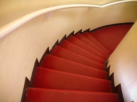 Red carpet on the White stairs in a interior