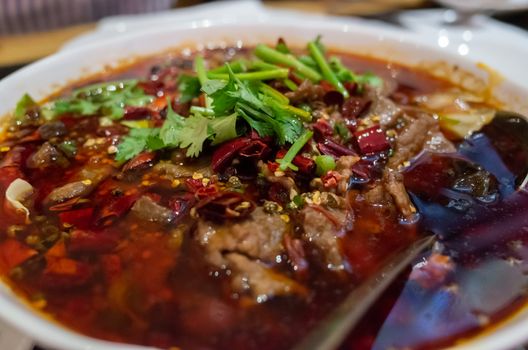 A bowl of spicy Sze Chuan hot pot beef