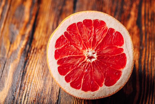 Half of Ripe and Juicy Grapefruit on Wooden Table.