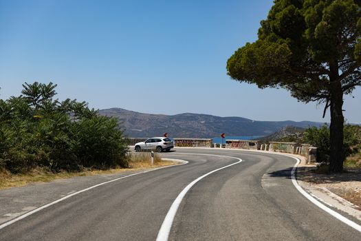 Bending automobile road in the hills of Croatia