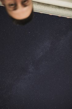 Man's head behind the Milky Way