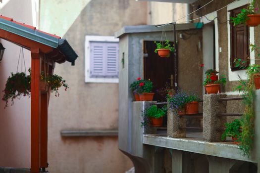 Summer balcony with flowers in the mediterranean european city