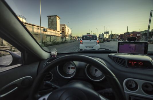 First-person view of a driver driving his car through traffic