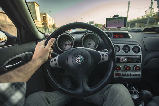 First-person view of a driver driving his car during a trip