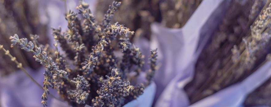 Panorama view dried lavender bouquet at local shop in Gainesville, Texas, America. Romantic flower in paper wrapper