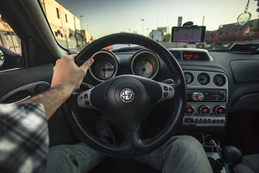First-person view of a driver driving his car during a trip
