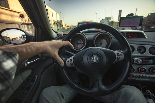 First-person view of a driver driving his car during a trip