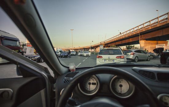 First-person view of a driver driving his car through traffic