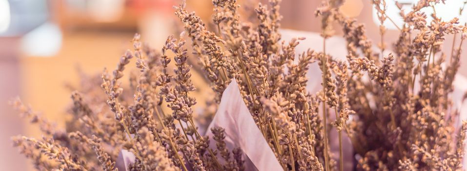 Panorama view dried lavender bouquet at local shop in Gainesville, Texas, America. Romantic flower in paper wrapper