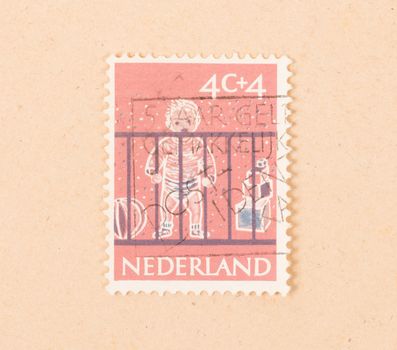 THE NETHERLANDS 1960: A stamp printed in the Netherlands shows a baby, circa 1960