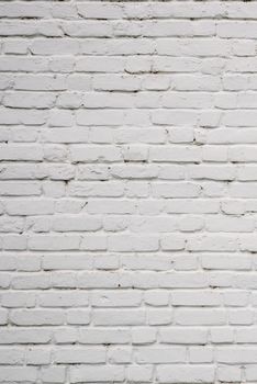 Background or texture of White Chipped Brick Wall.