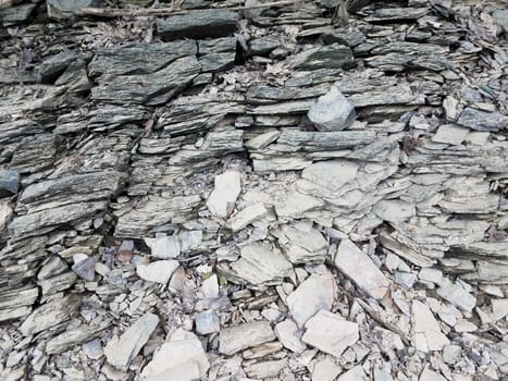 broken or chipped grey rocks or stones on the ground