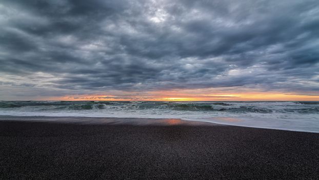 A very colorful and dramatic sunset over the Pacific Ocean.