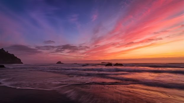 A very colorful and dramatic sunset over the Pacific Ocean.