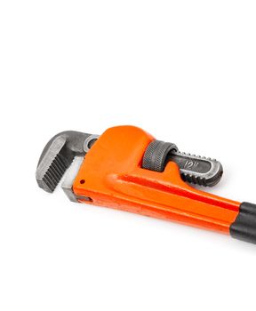 Red pipe wrench isolated on white background.