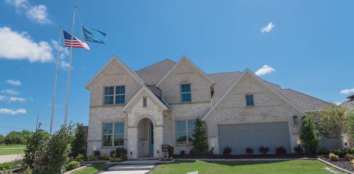 Panorama view two story house with attached garage in new development neighborhood near Dallas, Texas, USA.