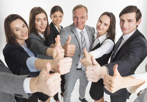 Business team showing thumb up isolated on white background
