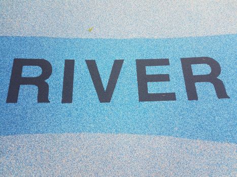 river sign on soft rubberized blue ground or floor
