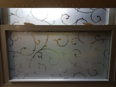 frosted glass window pane with lines and curves