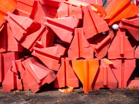 the orange traffic barrier barrels to detour traffic around construction zone shallow