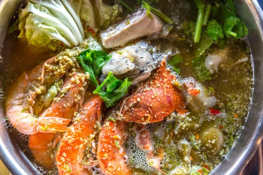 Seafood spicy hot pot crab prawn fish squid tumyum
