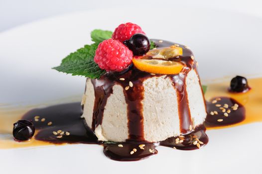 semifredo, italian ice cream dessert with halva, raspberry and chocolate sauce on top