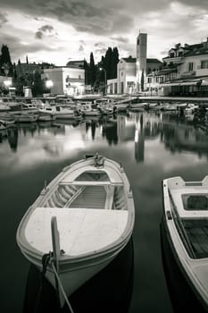 Malinska waterfront and harbor dawn black and white view, Krk island in Croatia