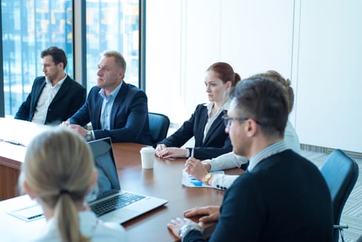 Image of business partners discussing documents and ideas at meeting