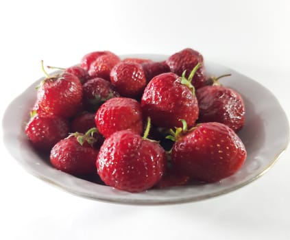 Red ripe strawberries. Photo of useful berries. Vegetarian food. Delicious and healthy dessert, vitamins.