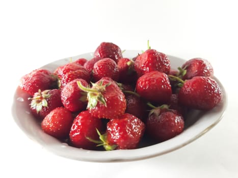 Red ripe strawberries. Photo of useful berries. Vegetarian food. Delicious and healthy dessert, vitamins.