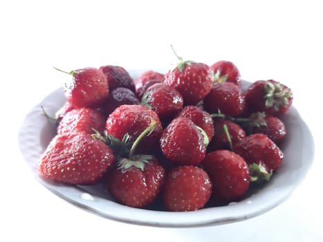 Red ripe strawberries. Photo of useful berries. Vegetarian food. Delicious and healthy dessert, vitamins.