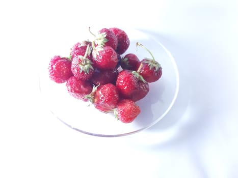 Red ripe strawberries. Photo of useful berries. Vegetarian food. Delicious and healthy dessert, vitamins.