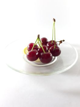Photo cherry and lemon. Healthy food. Vegetarian red food. Berries and fruits. Berry for snack. 